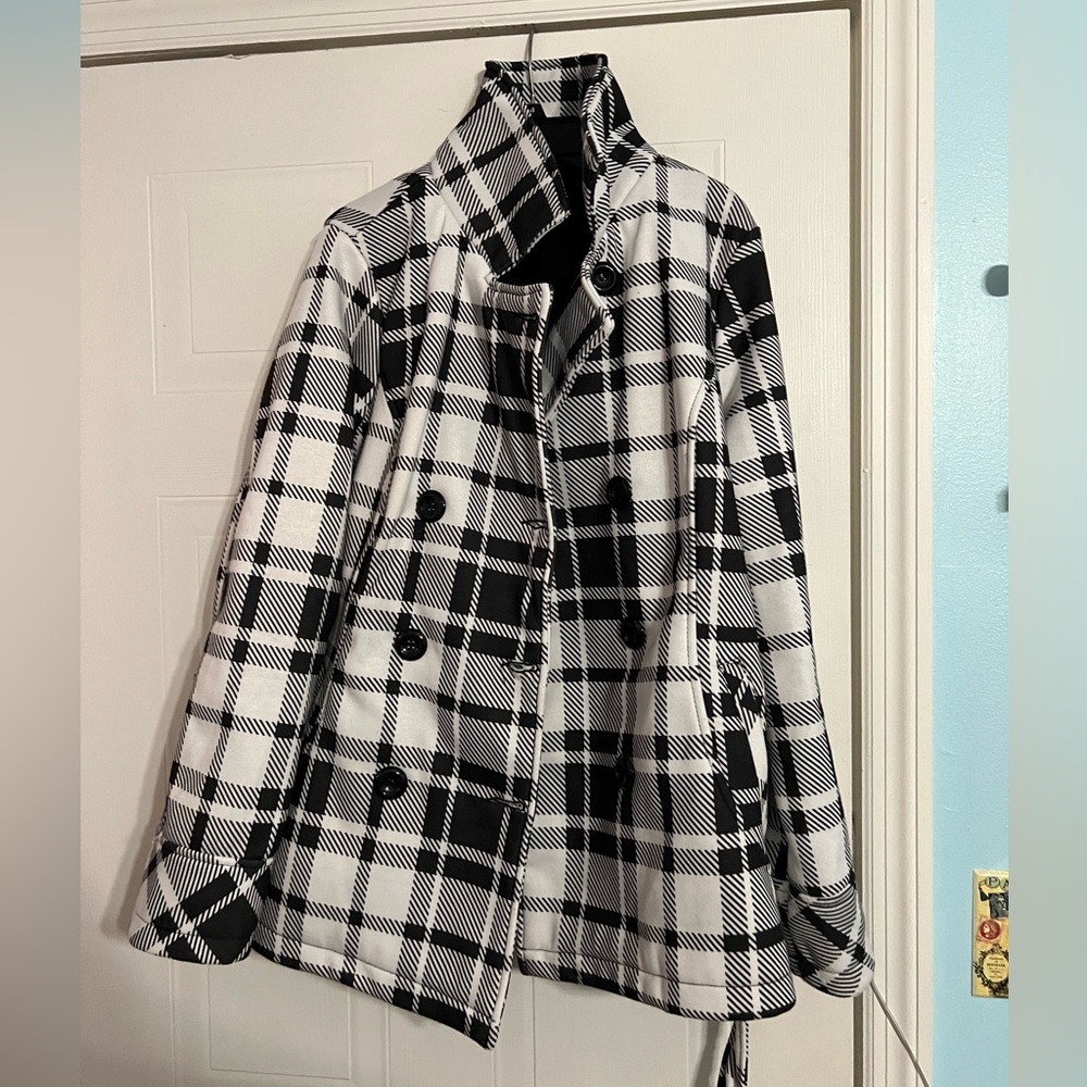 a cute, black and white, patterned, heavy winter coat